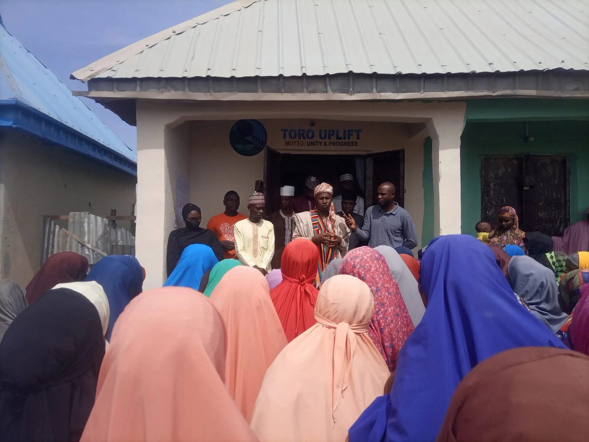 Participants gathered outside a building during an empowerment activity.